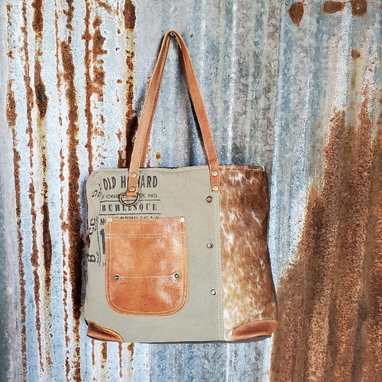 Green Canvas Brown and White Cowhide Tote Front